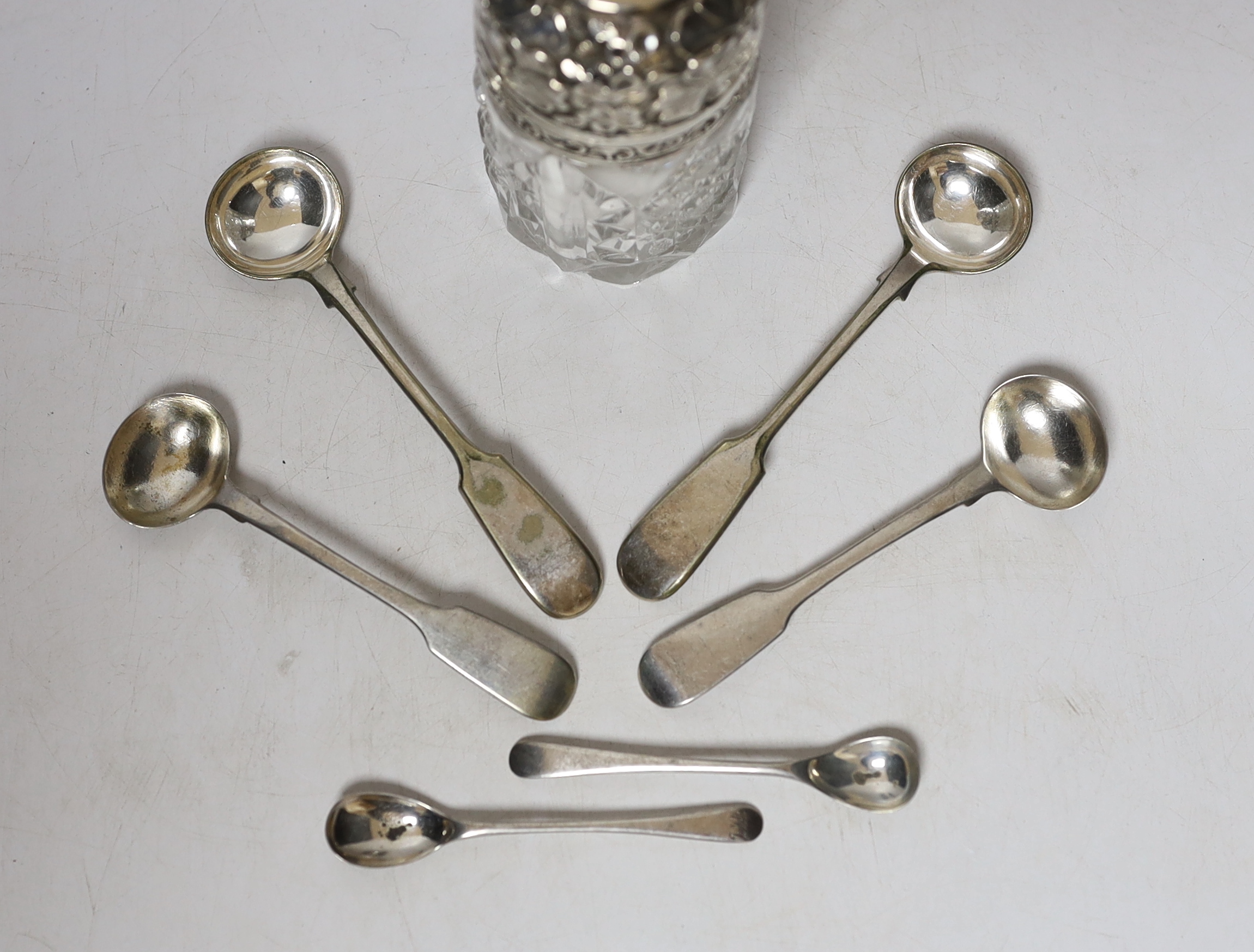 Four silver mustard ladles, including two 19th century, two plated ladles and an Edwardian silver mounted glass salts jar, London, 1905, 94mm.